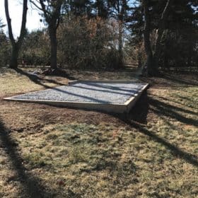 Gravel foundation for a portable storage building