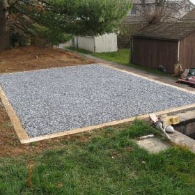 Finished gravel shed base for a storage barn