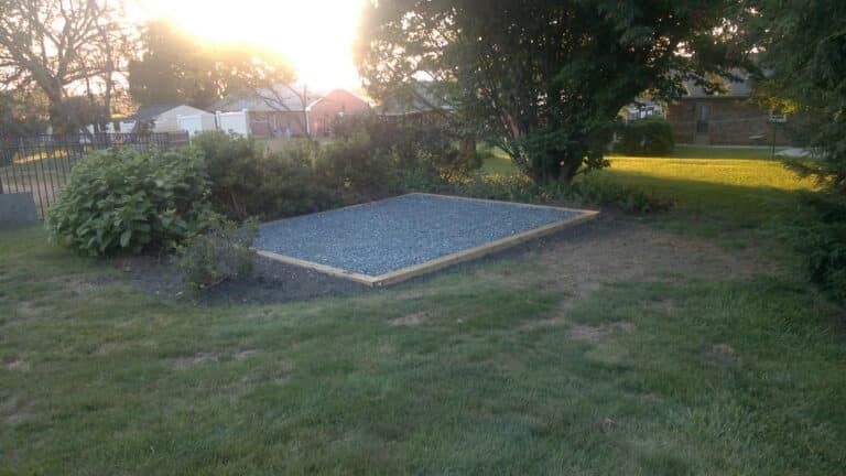 Gravel shed foundation installed in a backyard