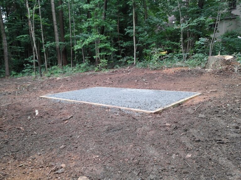 A gravel foundation for a prefab shed