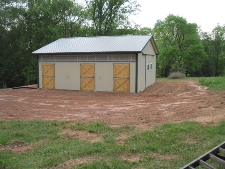 Horse barn with rubber horse stall mats