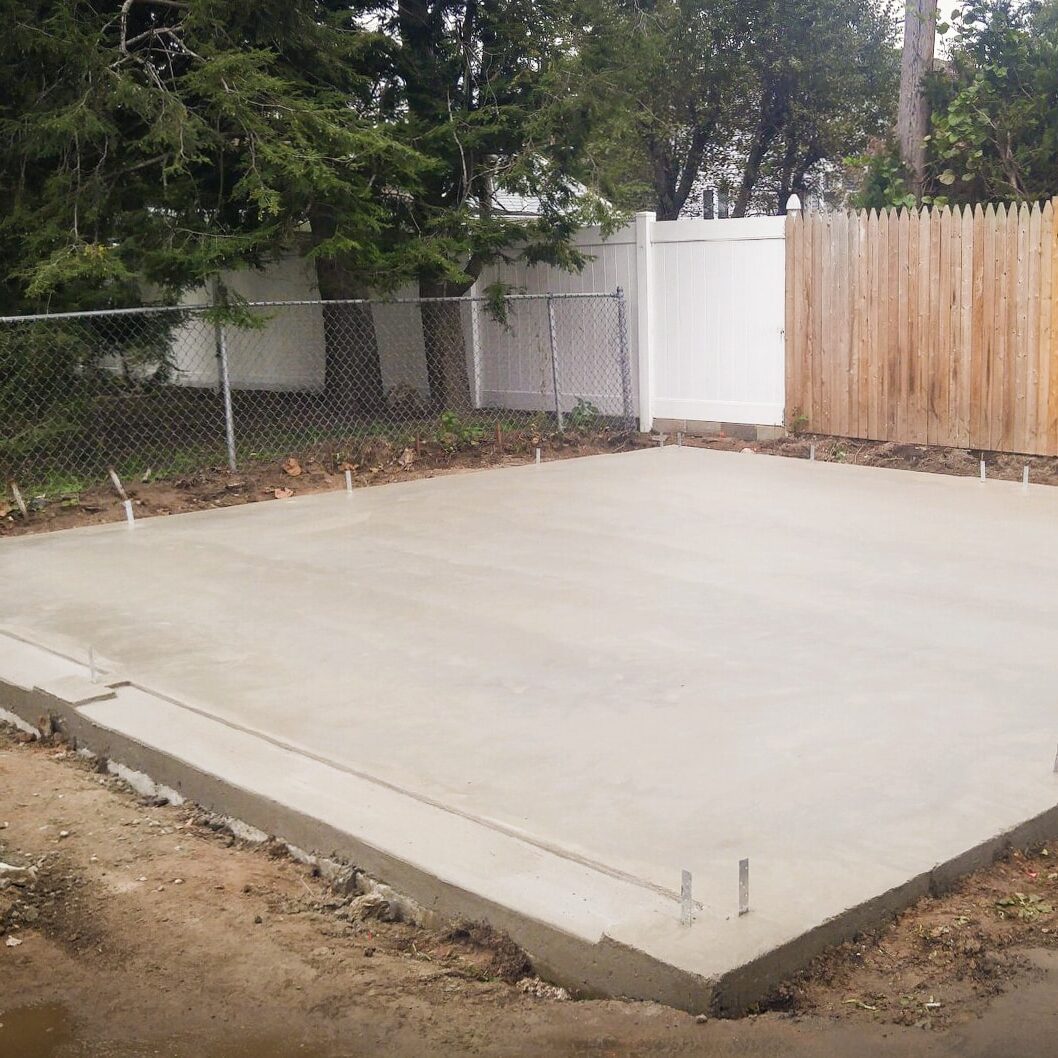 A concrete foundation installation for a garage or shed
