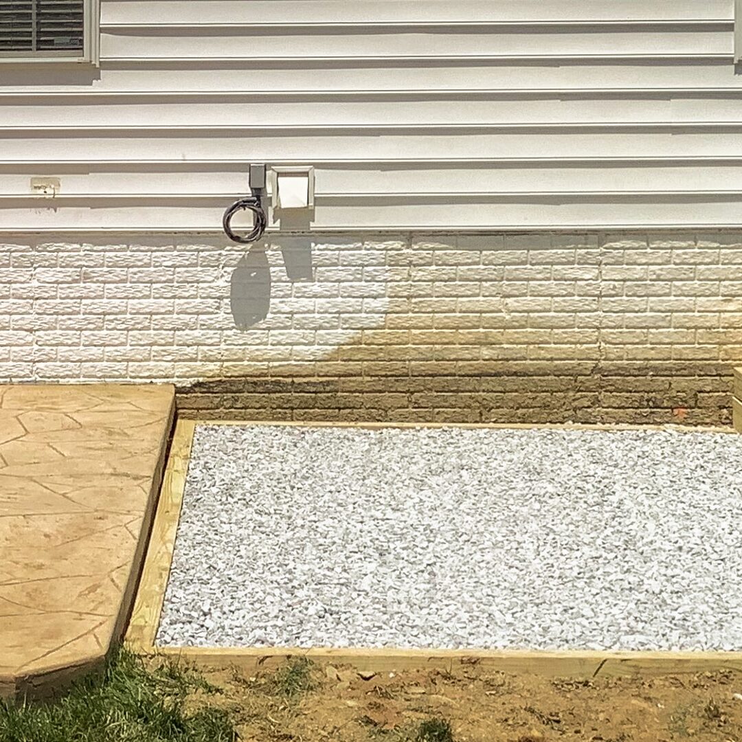 A gravel hot tub pad