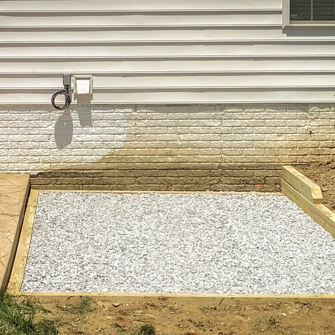 A gravel hot tub pad
