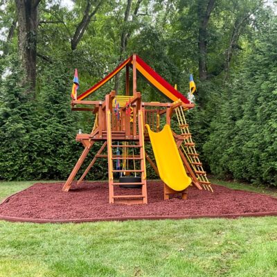 outside of a rubber mulch swingset base