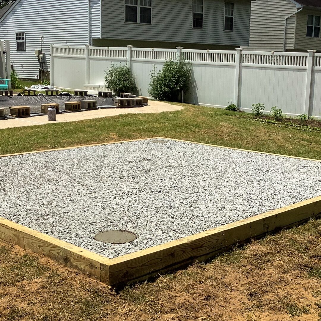 Gravel shed foundation with concrete pier shed footings