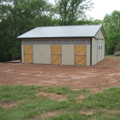 A horse barn with rubber stall mats