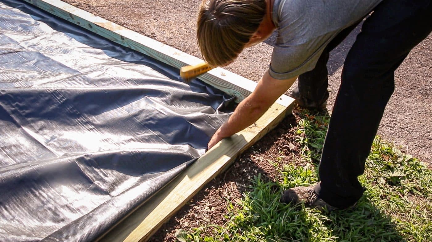 stapling-fabric-barrier-for-above-ground-pool-foundation