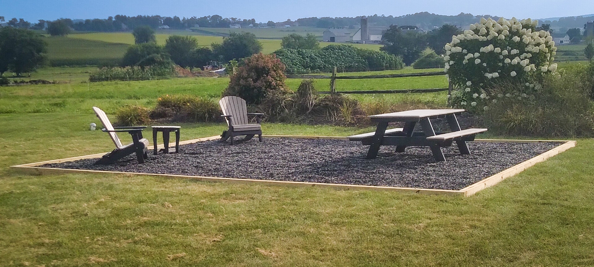 Gap, PA A gravel patio area for a fire pit with chairs and a picnic table
