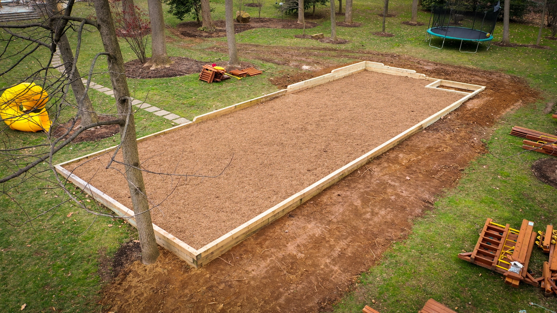 Site Prep Services in Connecticut leveling ground for swingset wood mulch pad