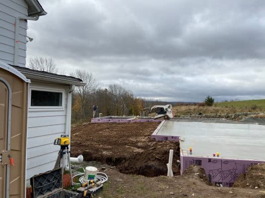 Contractors installing a garage foundation in Greeley, PA